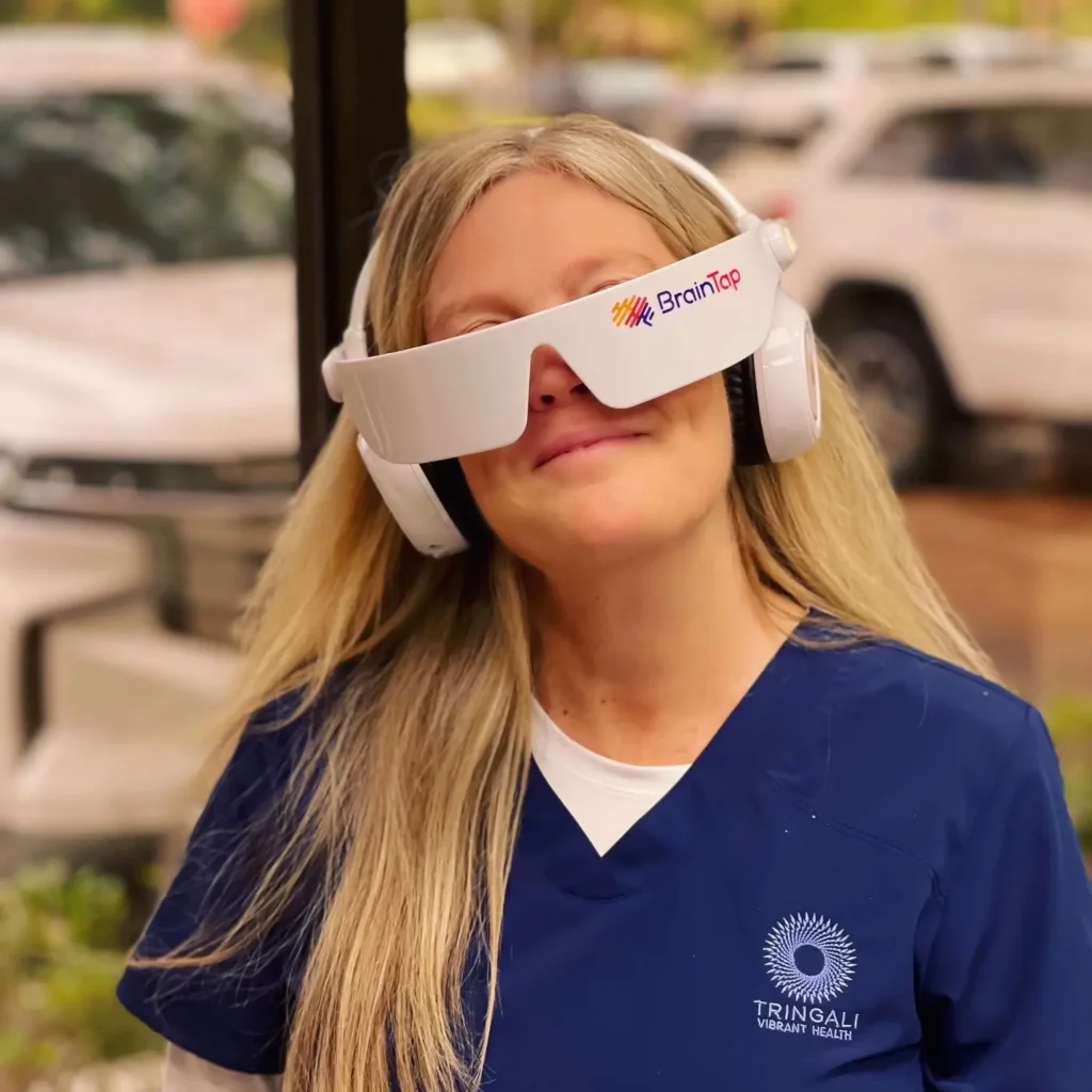 Woman wearing a BrainTap device