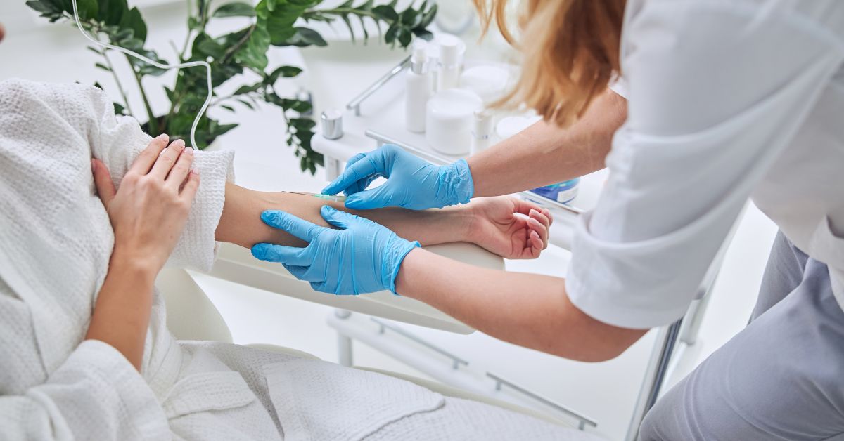 Woman receiving iv therapy to help hormone balance.